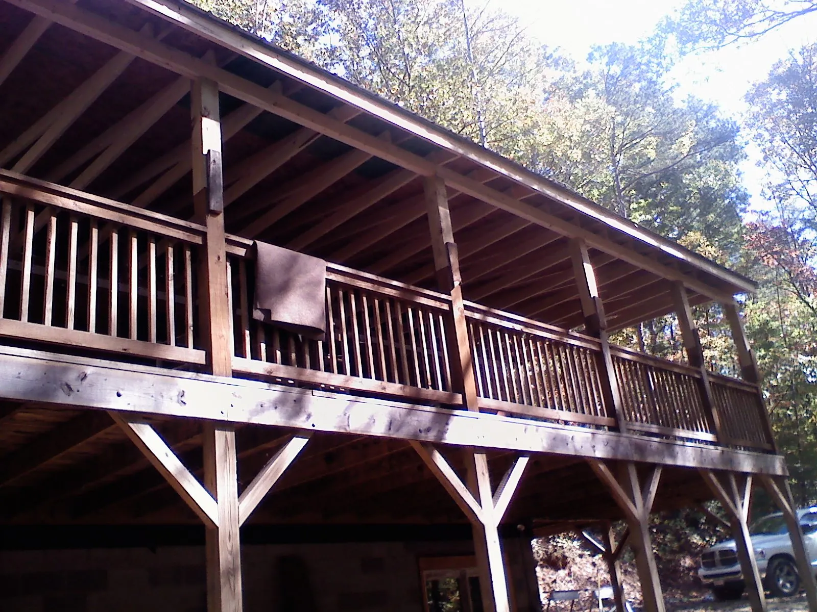Timber framing under a new elevated porch and deck — Roof Leak Repair in Grand Rapids by Roofing Brothers